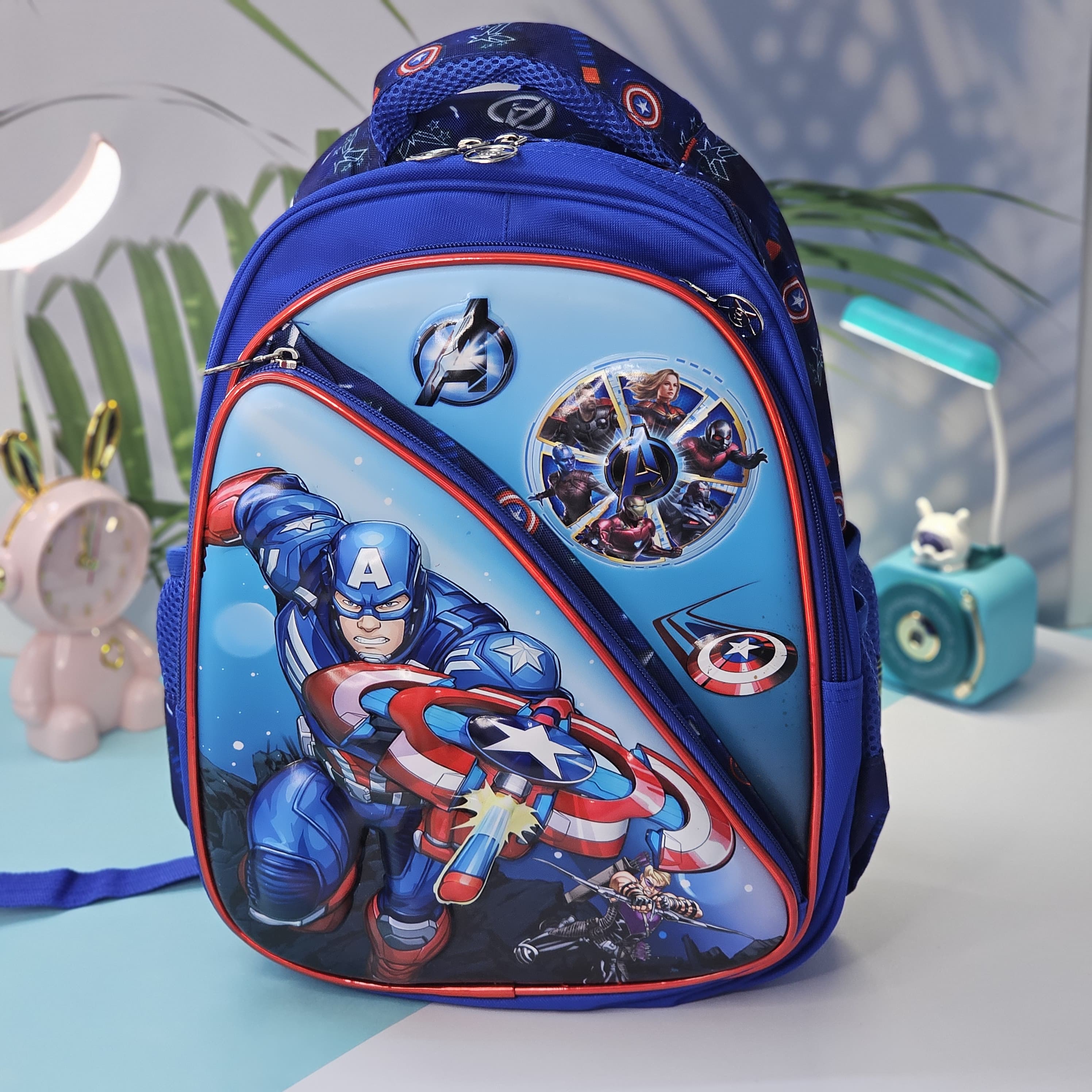 Front view of an Usmile Toys superhero backpack for kids, displaying detailed illustrations of Iron Man and other Avengers characters, suitable for school or travel." www.usmile.toys